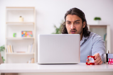 Young man doing marriage proposal via internet