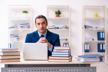 Fototapeta na wymiar Young businessman student studying at workplace