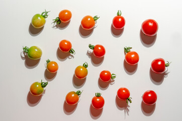 Colorful organic cherry tomatoes on a white background. Diet or healthy food