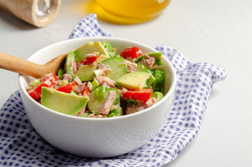 Cucumber tuna avocado salad on grey