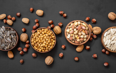 Mixed Nuts, dried fruits on wooden table, different kind of healthy food