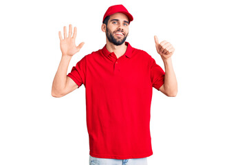 Young handsome man with beard wearing delivery uniform showing and pointing up with fingers number six while smiling confident and happy.