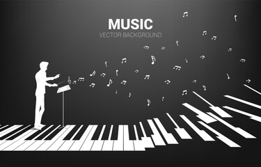 Vector silhouette of conductor standing with piano key with flying music note . Concept background for piano concert and recreation. © Panithan