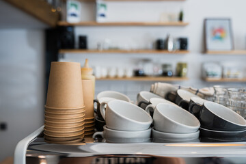 A kitchen countertop and a sink with dishes.