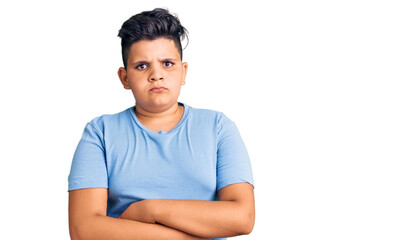 Little boy kid wearing sports workout clothes skeptic and nervous, disapproving expression on face with crossed arms. negative person.