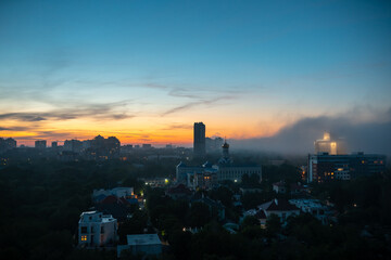 Naklejka premium View of residential buildings at the sunset with cloudy sky.