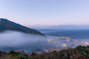 Naklejka na ściany i meble A fantastic image of fog down the river was shot in Japan