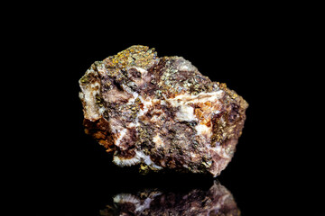 Chalcopyrite copper ore, raw rock on black background, mining and geology