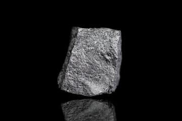 Magnetit ore, raw rock on black background, mining and geology