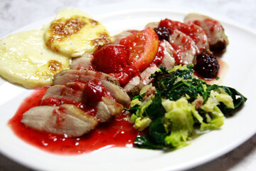 Duck with sauce and vegetables