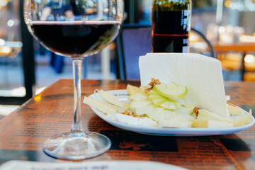 red wine in a glass with fruit appetizer