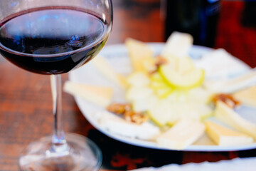 red wine in a glass with fruit appetizer