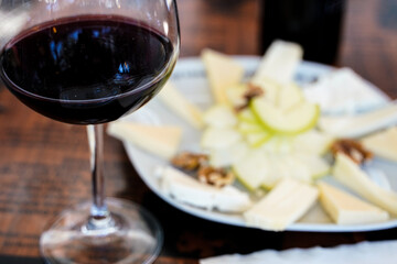 red wine in a glass with fruit appetizer