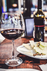red wine glass bottle service romantic table in a cafe restaurant