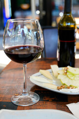 red wine glass bottle service romantic table in a cafe restaurant