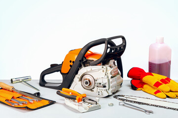 Repair of chainsaws,gasoline powered tools. repairing a chainsaw in repair shop.