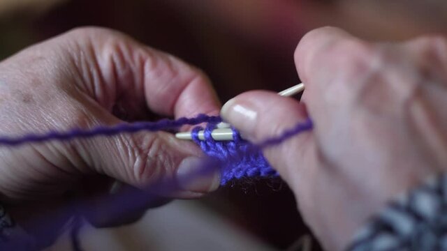ederly woman hands Knitting doing crochet slow motion 4k