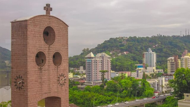 4K Timelapse of the Blumenau Cathedral Tower with cars passing over the bridge
