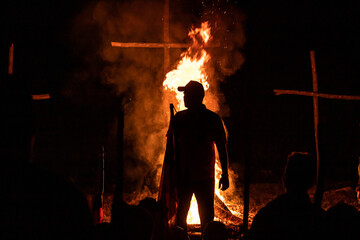 Man silhouette with bonfire backlight