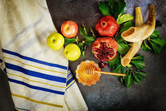 Shofar and food with talit for jewish holiday Rosh Hashanah.