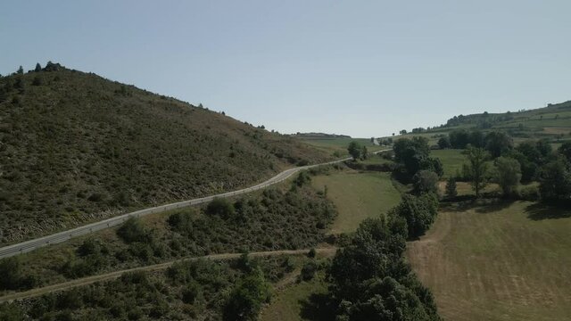 Aerial view following a mountain road on the countryside in Montella, La Cerdanya, Catalunya