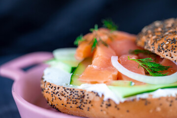 Cream cheese everything bagel with smoke salmon, onions, and dill pepper.