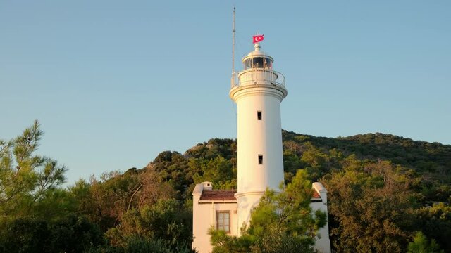 Lighthouse at Gelidonya cape in Mediterranean sea at sunset, Antalya.
