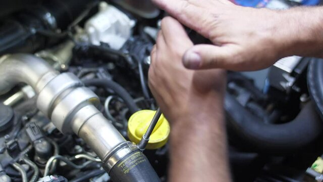 mechanic working on car engine slow motion 4k