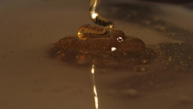 pouring honey on honey slow motion 4k