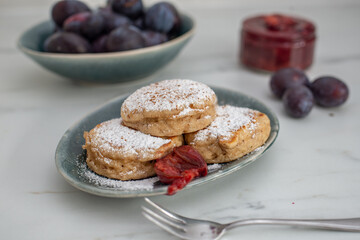 home made blini pancakes with plums