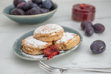home made blini pancakes with plums
