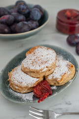 home made blini pancakes with plums
