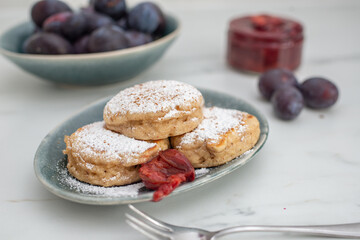 home made blini pancakes with plums