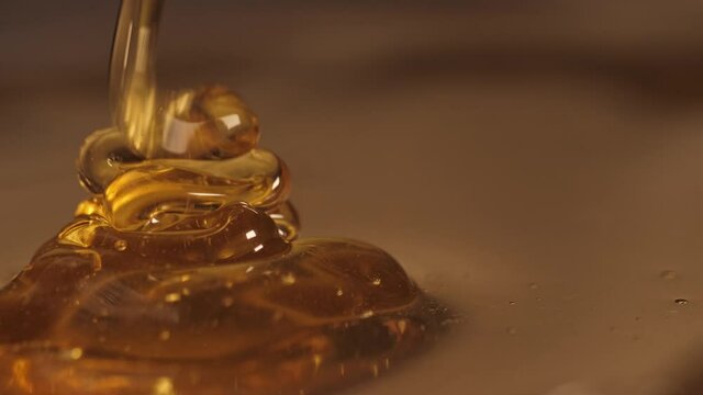 pouring honey on honey slow motion 4k