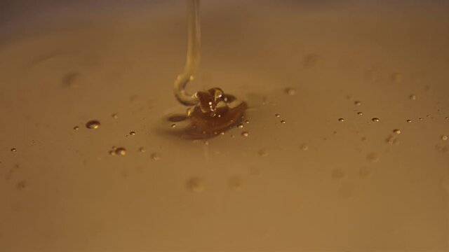 pouring honey on honey slow motion 4k