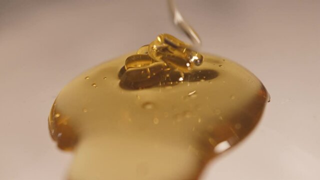 pouring honey on honey slow motion 4k
