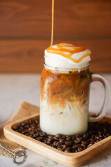 Iced Latte coffee in a glass with caramel