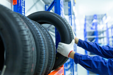 New tires that change tires in the auto repair service center in the stock blur for the industry, a...