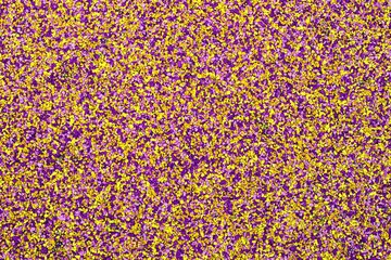 Bright colored shock-absorbing crumb rubber coverings used on playgrounds, stadiums, and running tracks.