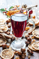Glass with mulled wine and spices, close up
