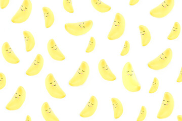 pattern made with toy yellow sleeping smiling moon 
