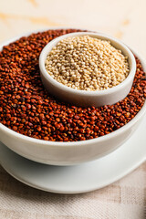 Bowls with healthy quinoa on table, closeup