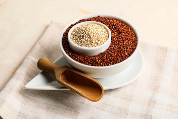 Bowls with healthy quinoa on table