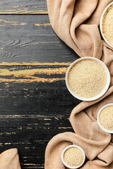 Bowls with healthy quinoa on table