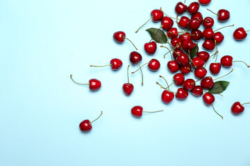Ripe sweet cherry on color background
