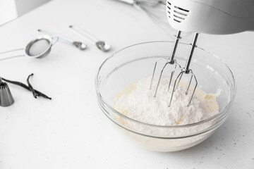 Preparing of meringue with mixer in kitchen