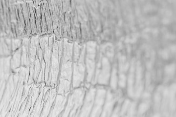 Crumpled aluminum foil texture. Shallow depth of field.