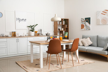 Interior of modern stylish kitchen with dining table