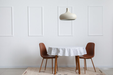 Dining table near white wall