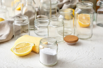 Jars with natural detergents on white background. Ecology concept